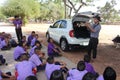 Asian teacher is teaching the music note for student group.